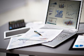 Computer with financial graphs