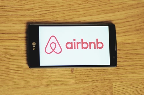 Airbnb logo on cellphone