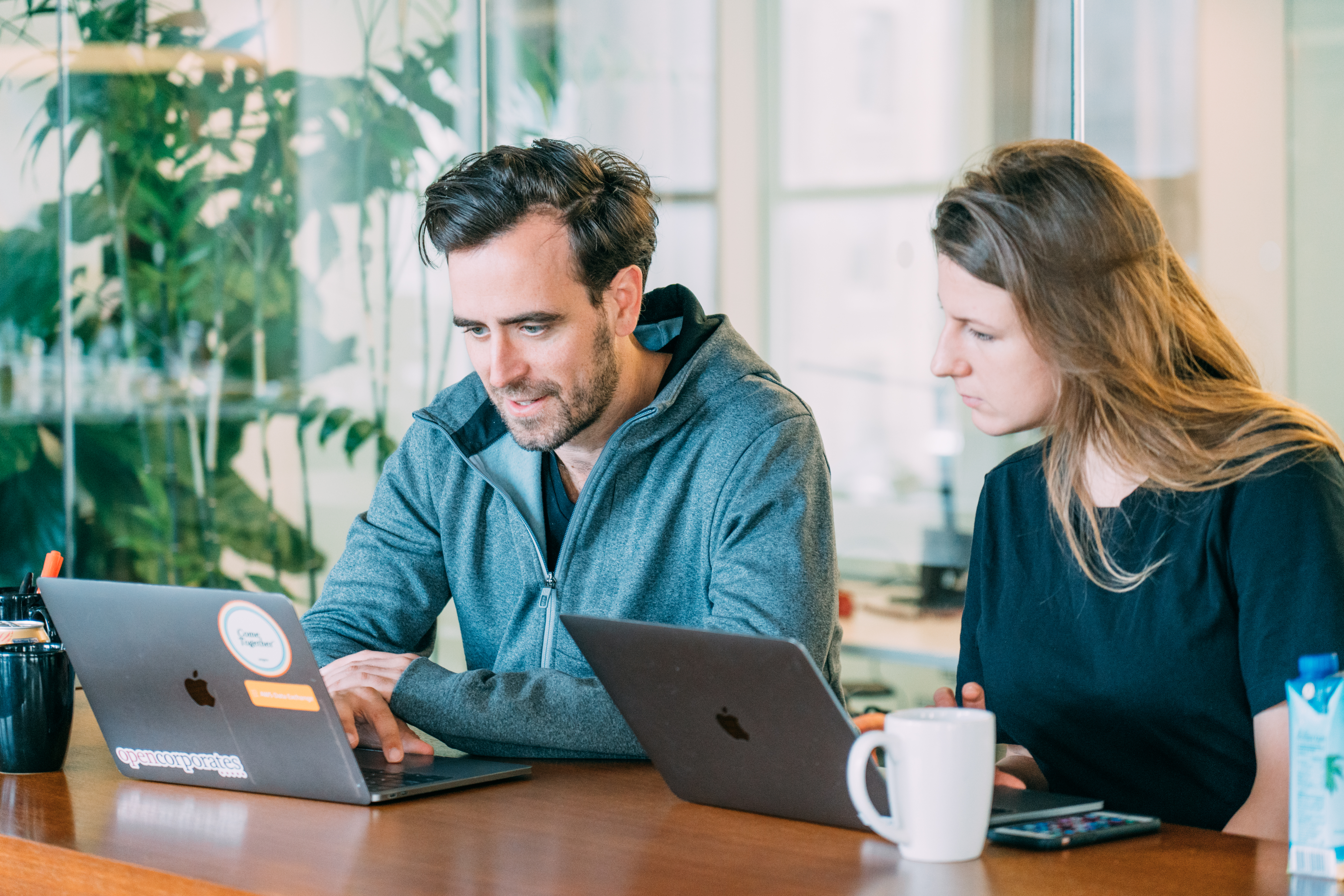 Two people working together at the New York Enigma office.