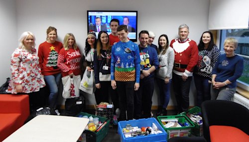 Blog image for Later life planning firm donates trolley loads of goods to food bank