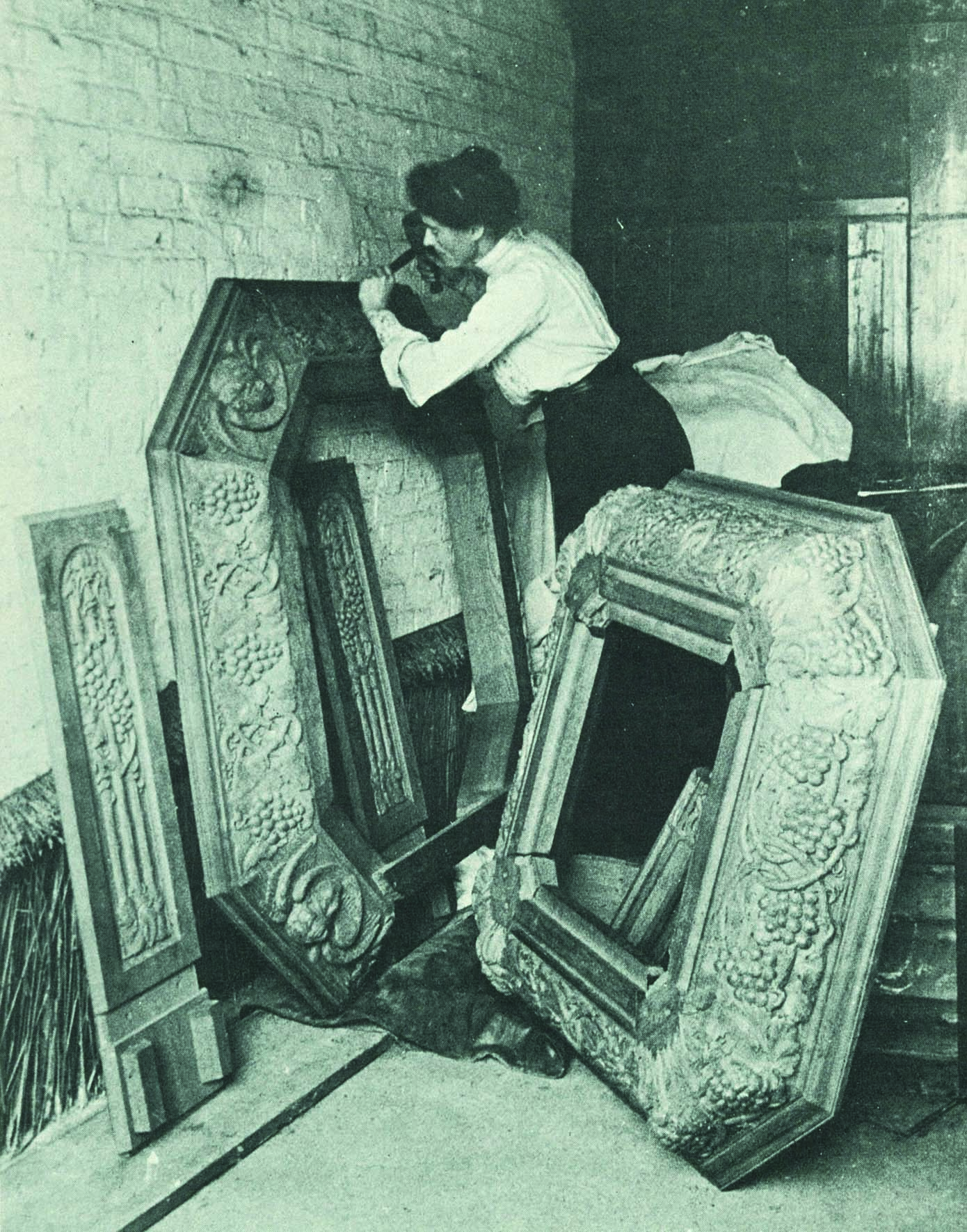 An older-style photo of Nellie carving timber pieces for St Andrews Church Westbury, Tasmania