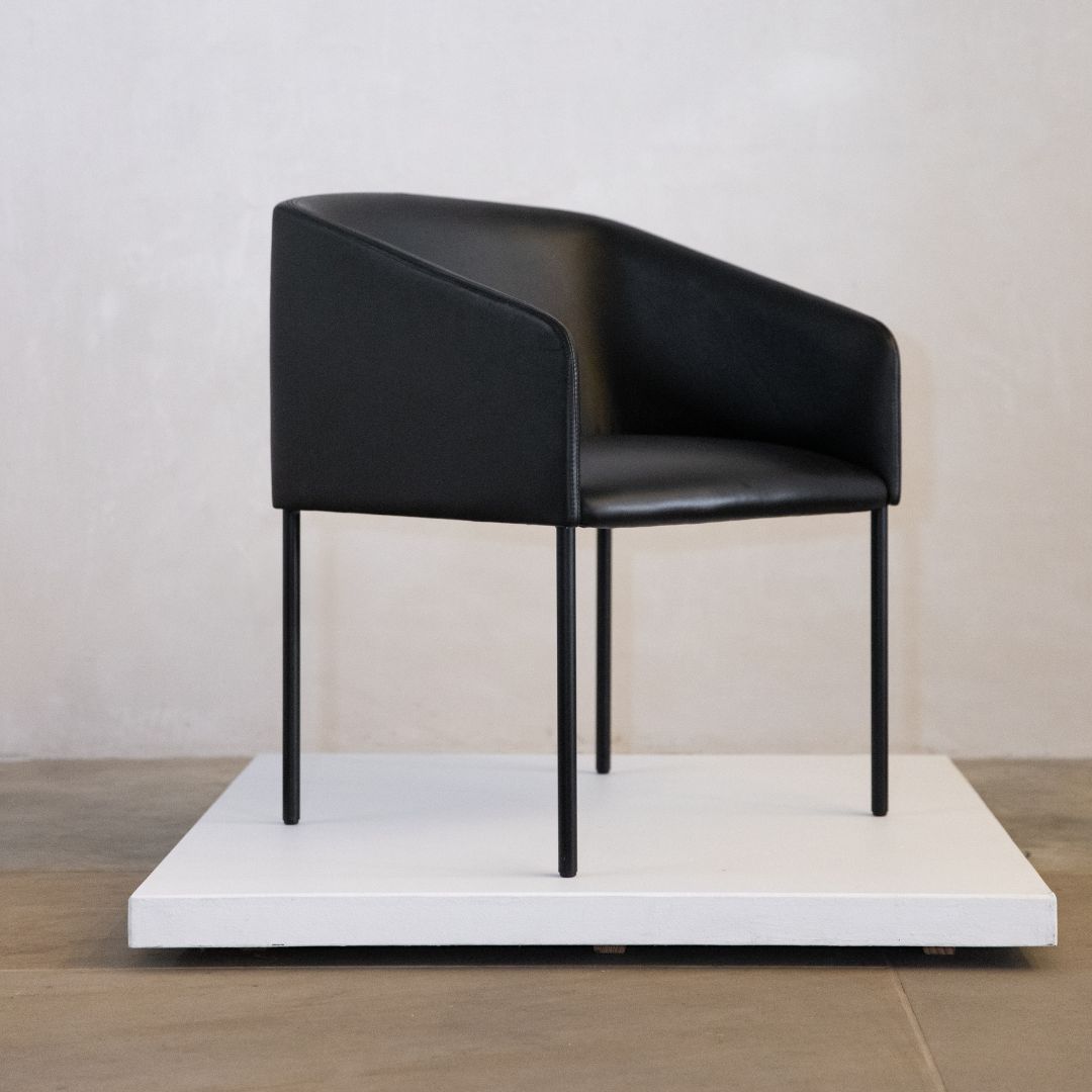 A black chair with steel legs