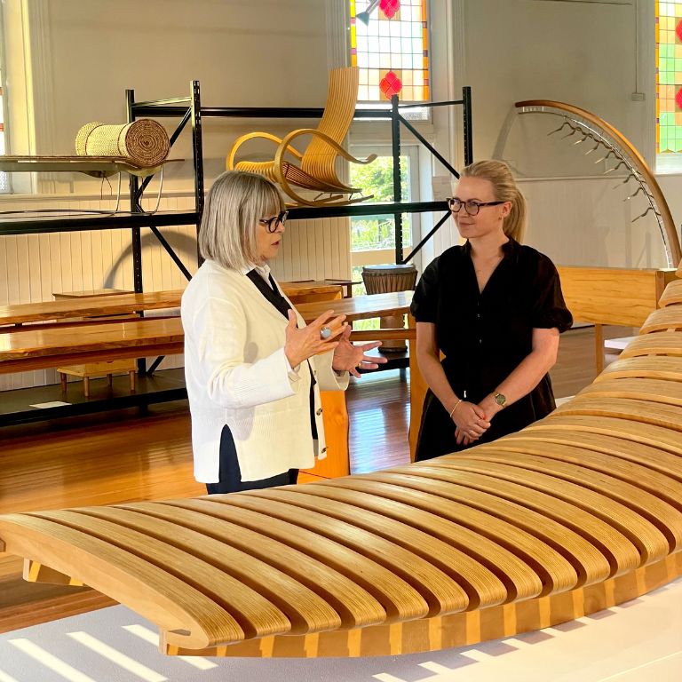 Our volunteer showing the Design Tasmania Wood Collection to an interested visitor