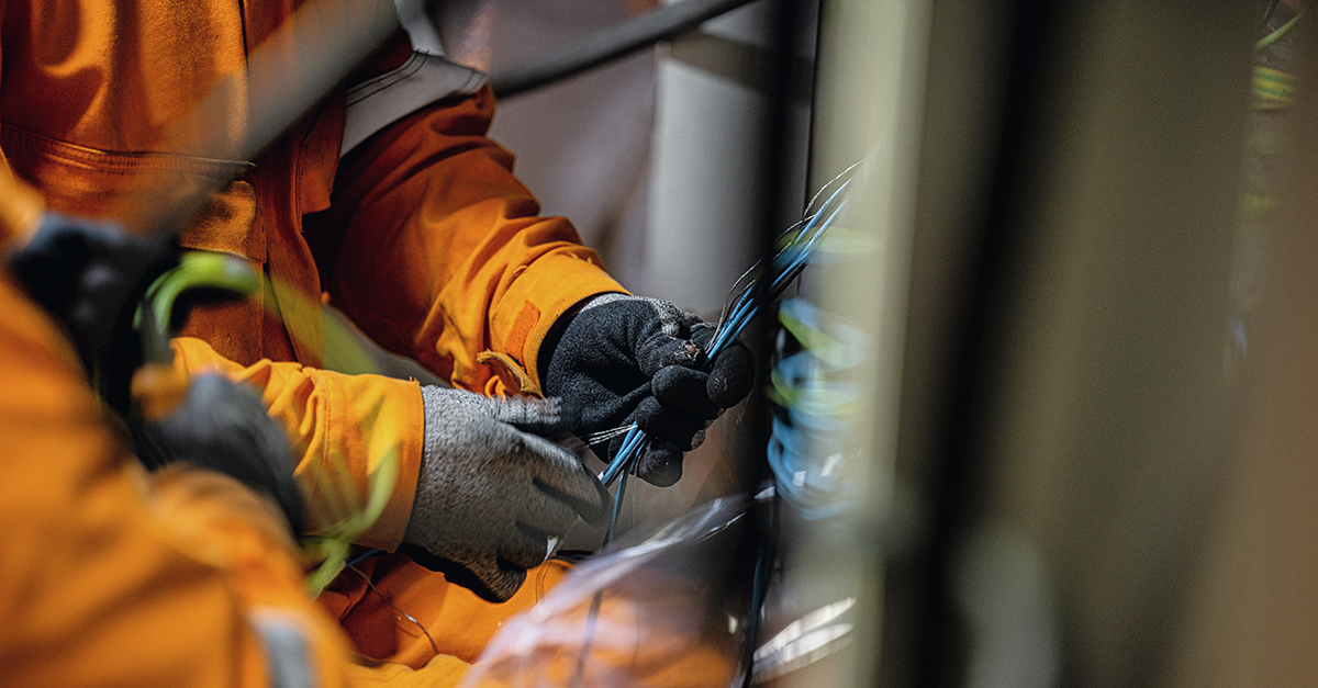 electrical contractor touches cables