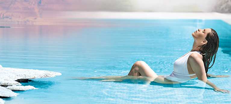 woman bathing in a mineral swim pool