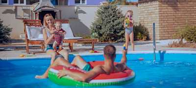family swimming in a magnesium swimming pool