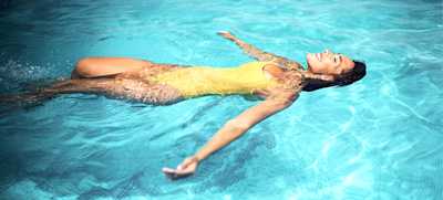 woman floating on a magnesium pool