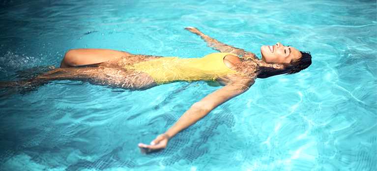woman floating on a magnesium pool