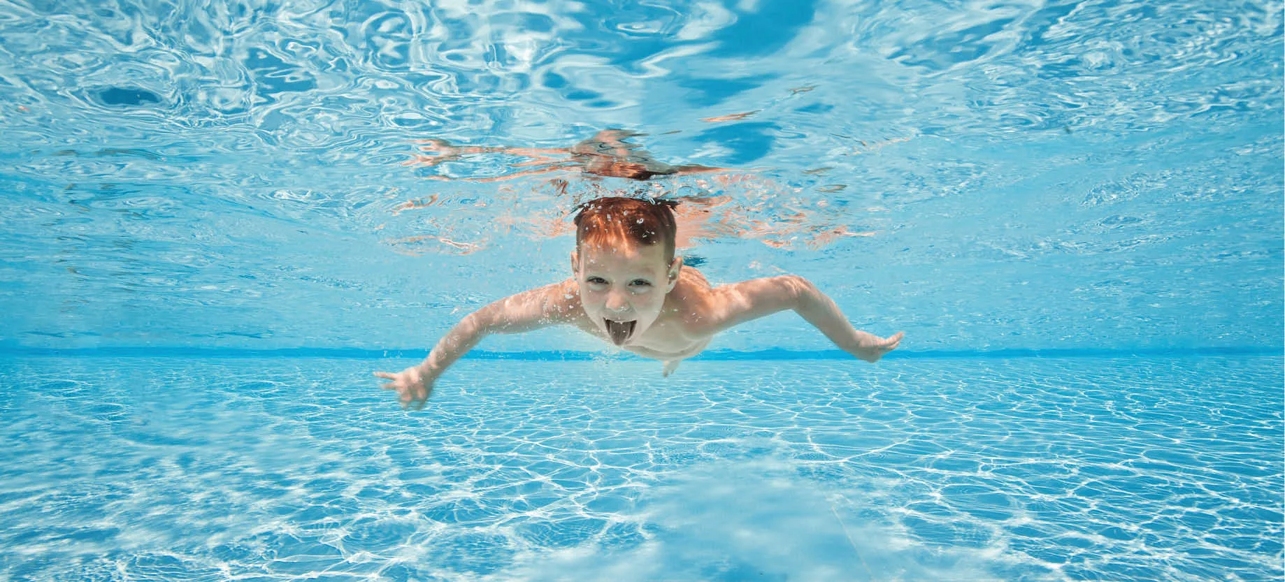 Kid swimming under water
