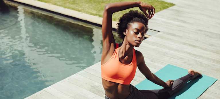 woman doing yoga on a magnesium rich pool