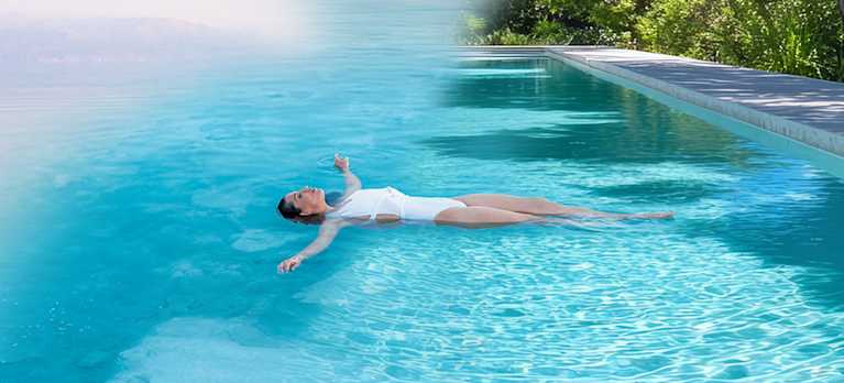 woman floating on a magnesium swimming pool