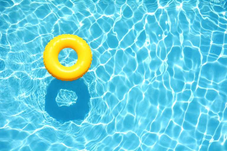 Yellow doughnut floaty in clear blue pool - blog image