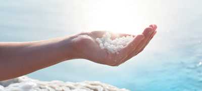 hand holding mineral swim dead sea minerals