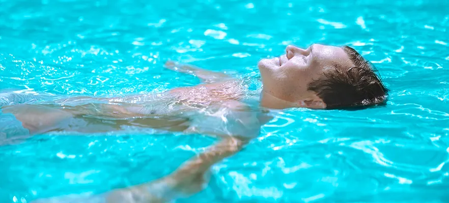 Mineral Swim Blog bring the dead sea to your pool - man floating in pool