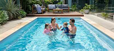 family in a mineral pool