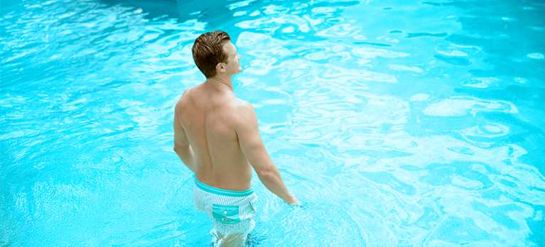 man swimming in a magnesium swimming pool