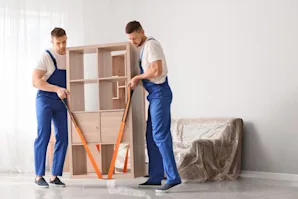 Two movers moving a shelf