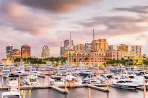 Skyline view of St. Port Lucie with the harbor and boats in the foreground.