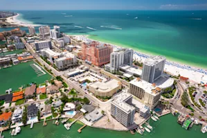 Aerial view of Clearwater, FL with skyscrapers surrounded by water
