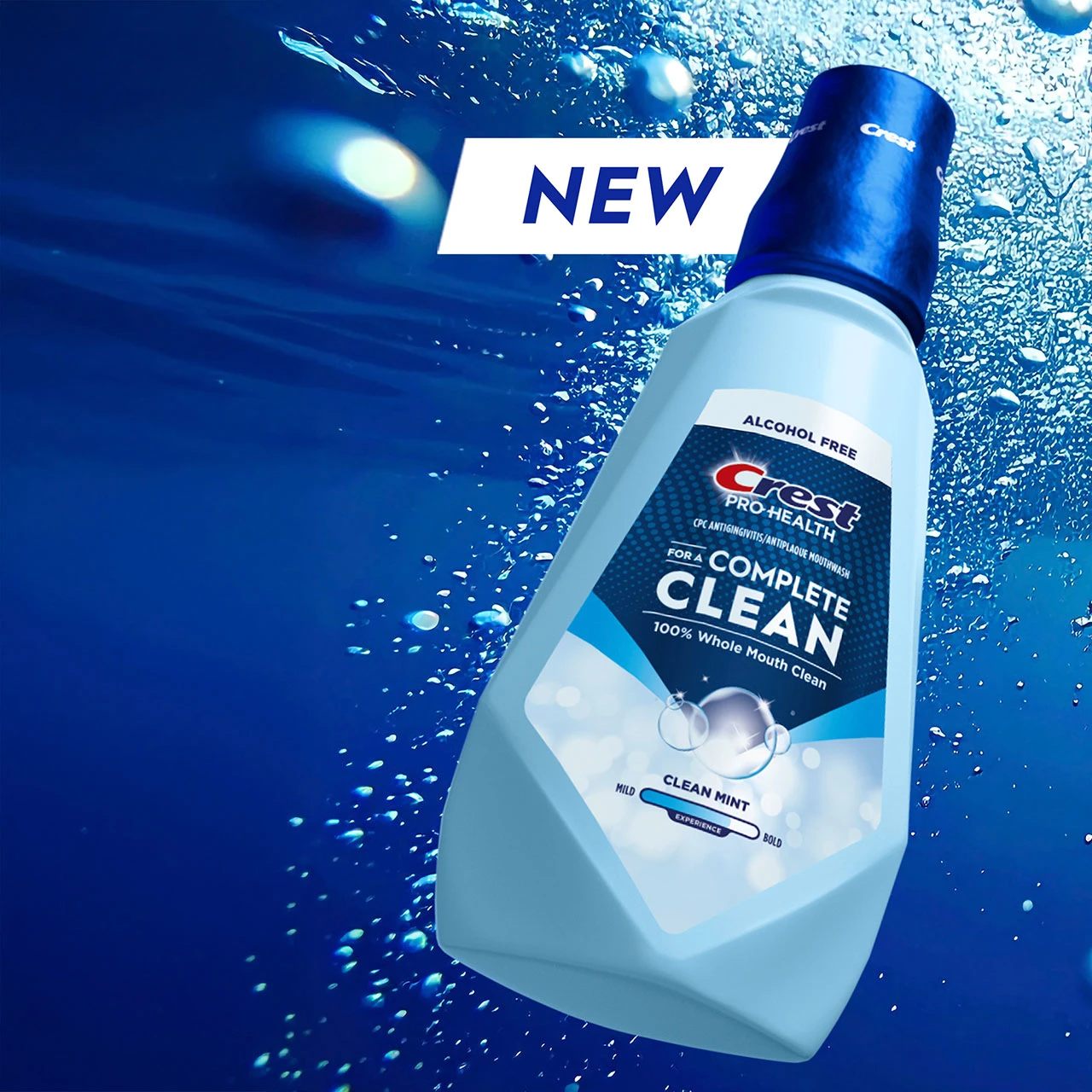Crest Pro‑Health Clean Mint mouthwash bottle with 'NEW' label on a blue water background.