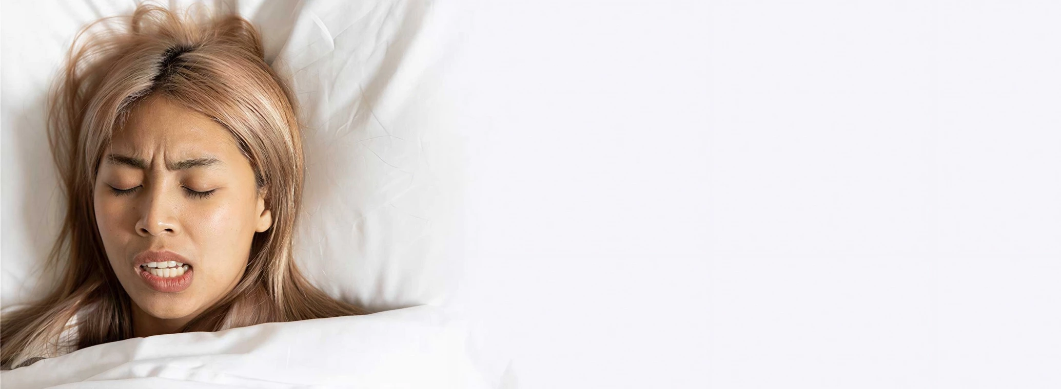 Woman sleeping and grinding her teeth