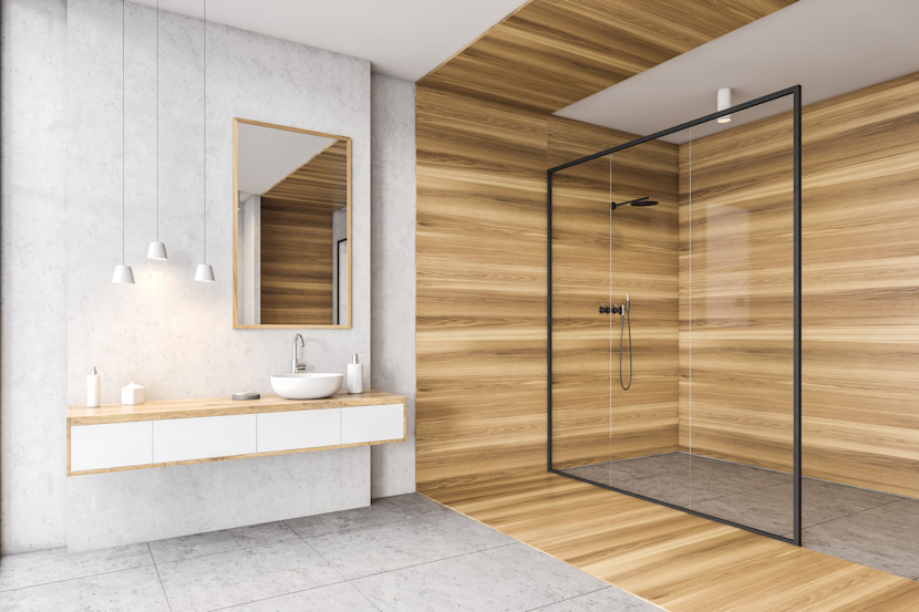 Curbless shower with wooden wall and ceiling, floating vanity and mirror with pendant lights