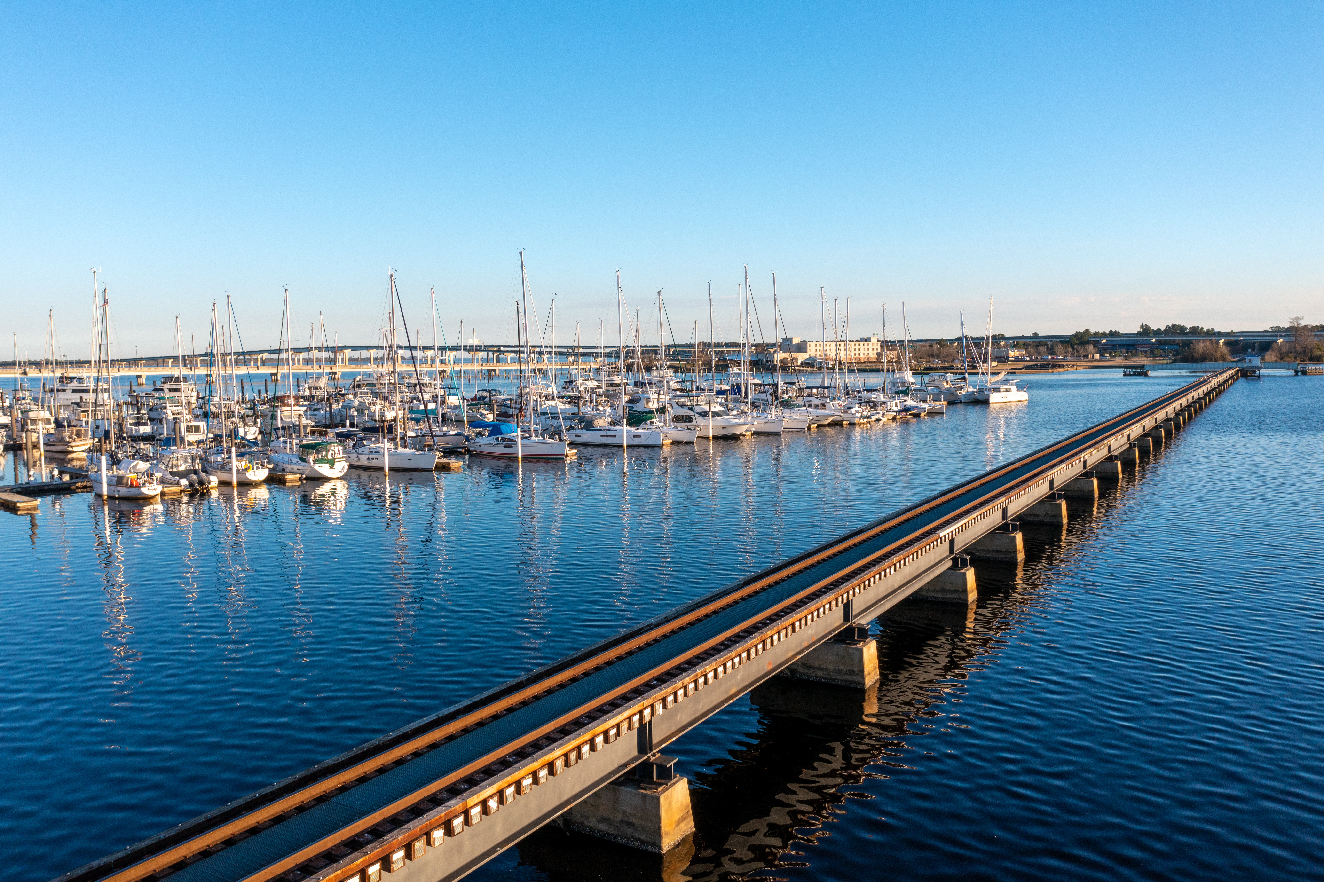 marina with several sailboats along side roads