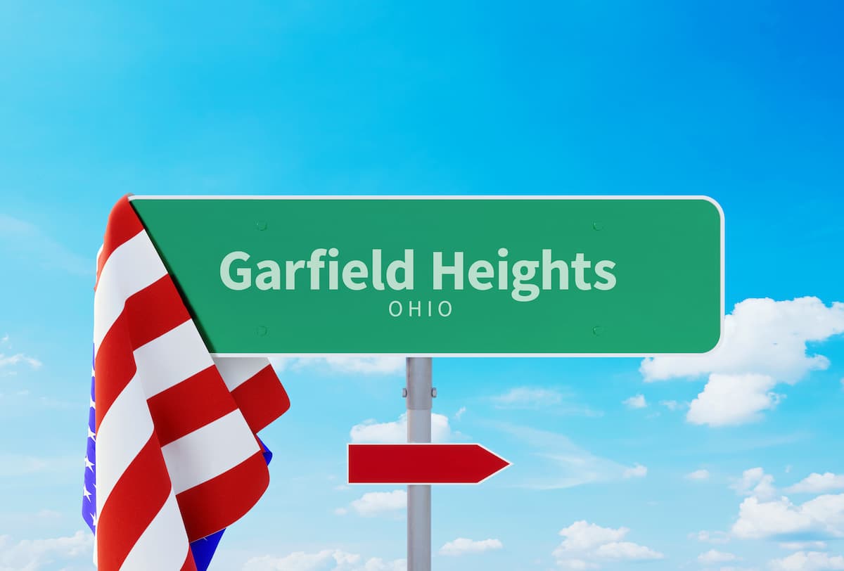 Road sign for Garfield Heights with a US flag