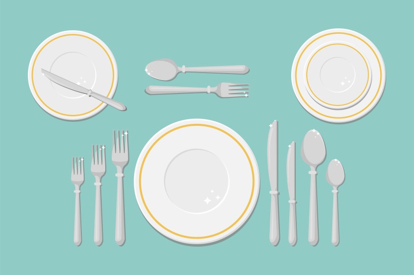 An example of a formal place setting, with charger plates, forks on the left, knives and spoons on the right of the plate, with bread and butter plates on the top