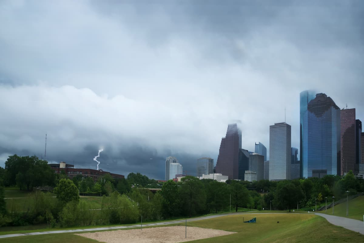 Thunderstorm with lightning approaching Houston over the skyscrapers