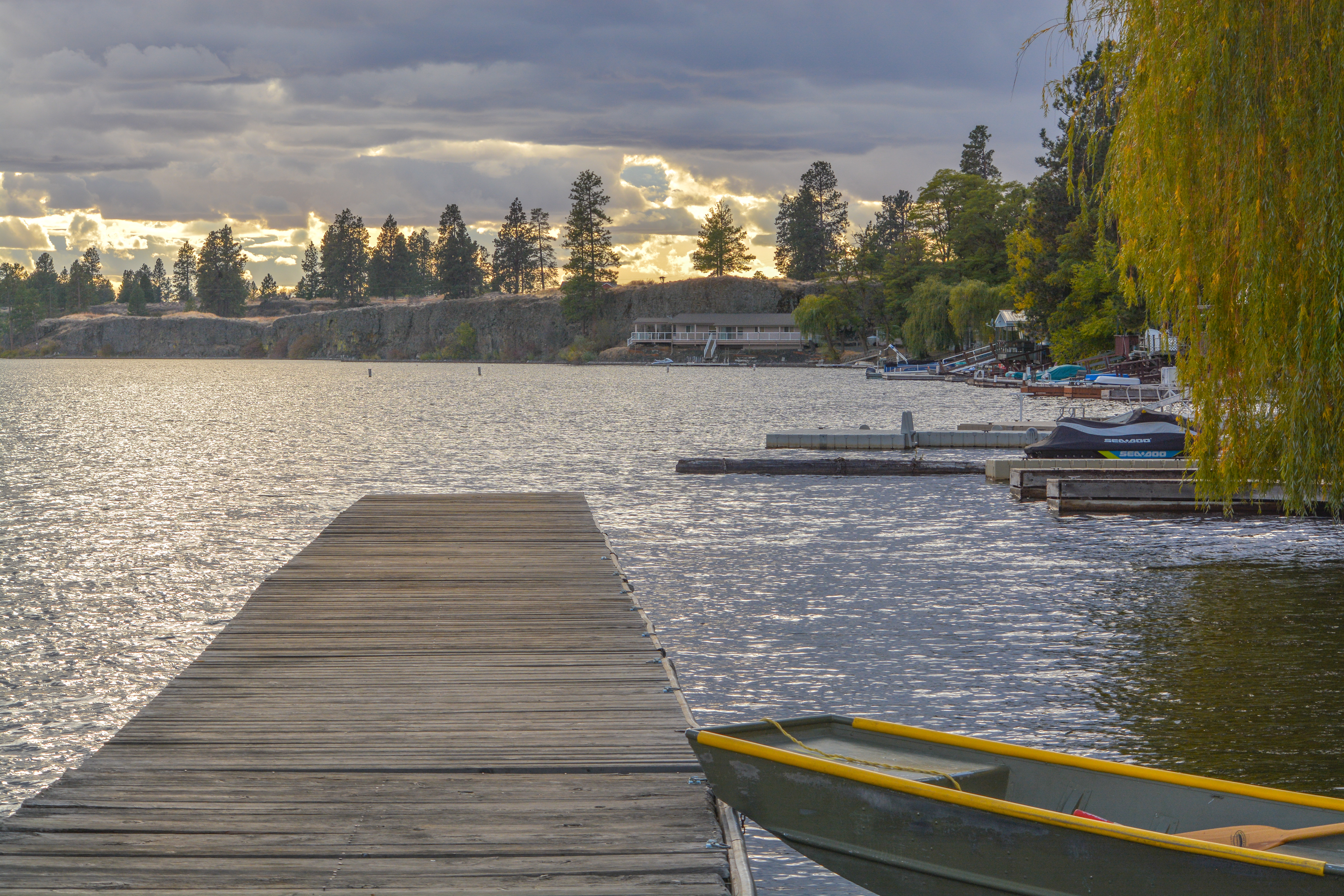Fishing dock on tree-lined lake