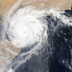 Will Hurricane Harvey have an impact on UK energy prices? Image of a swirling hurricane cloud over land and sea taken from space satellite.