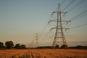 Is National Grid public ownership the answer? A line of pylons in a field.