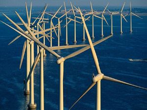 PM’s wind power promise Wind turbines in a row above water.