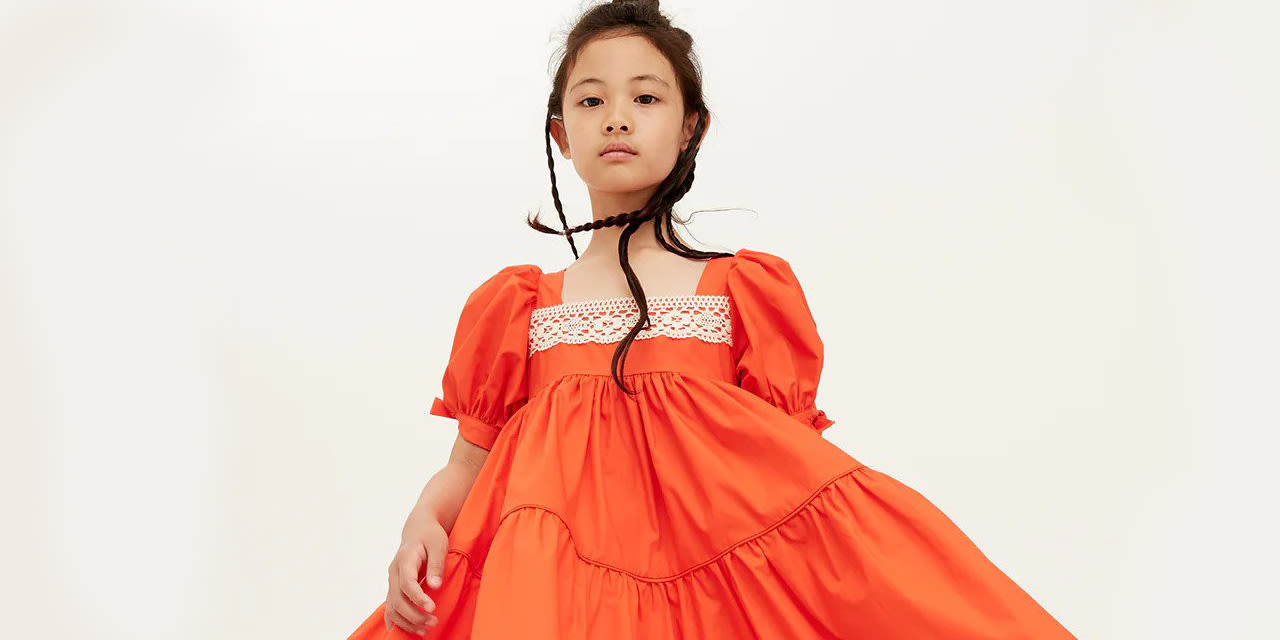 Girl wearing a The Middle Daughter dress