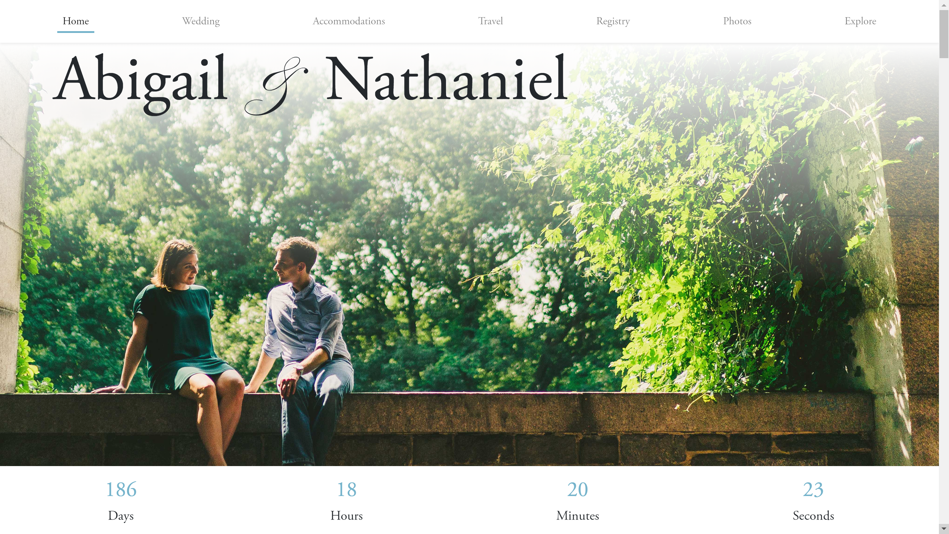 The home screen of abigailandnathaniel.com, featuring an image of a couple sitting on a stone wall with a wedding countdown timer.
