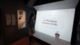 Visitor viewing the projected mapped film
