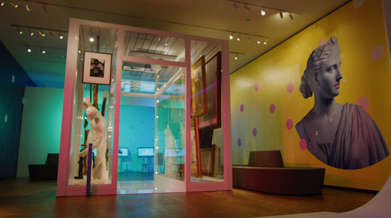 The Artquarium brings together paintings, statues, artifacts, and photographic reproductions under one theme, letting visitors like this young girl see these different pieces next to each other.