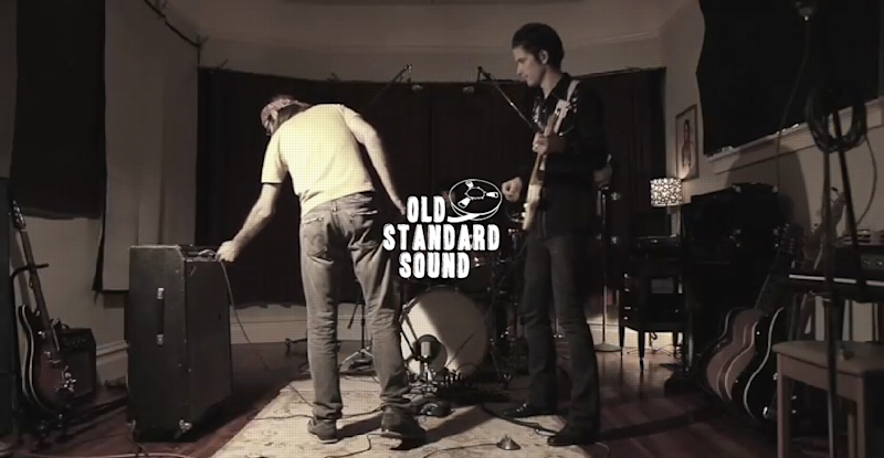 Screenshot from the Old Standard Sound website video showing a band practicing.
