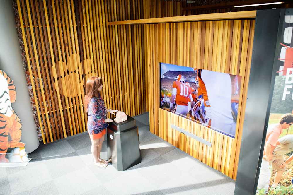 Touching the Howard’s Rock replica plays a video of the iconic moment where Clemson Tigers run onto the football field.