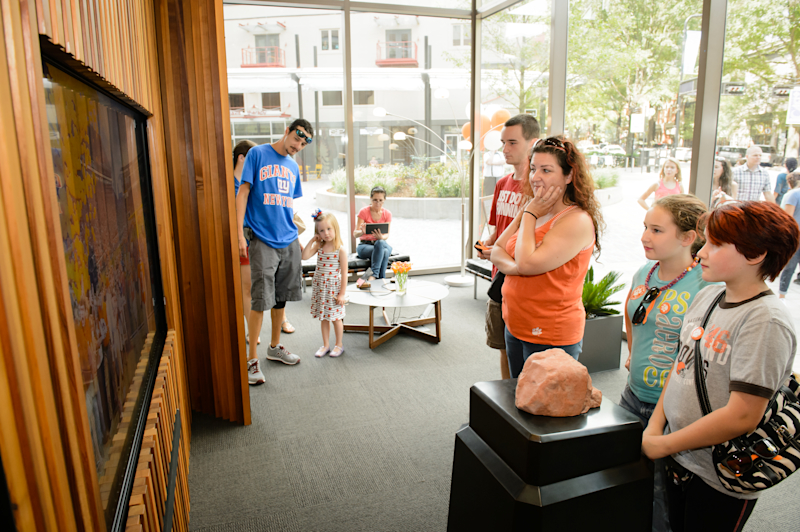 Facing Main Street, the Giving 110% video screen draws in passersby as well.