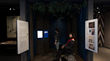 Visitors viewing underground railroad film