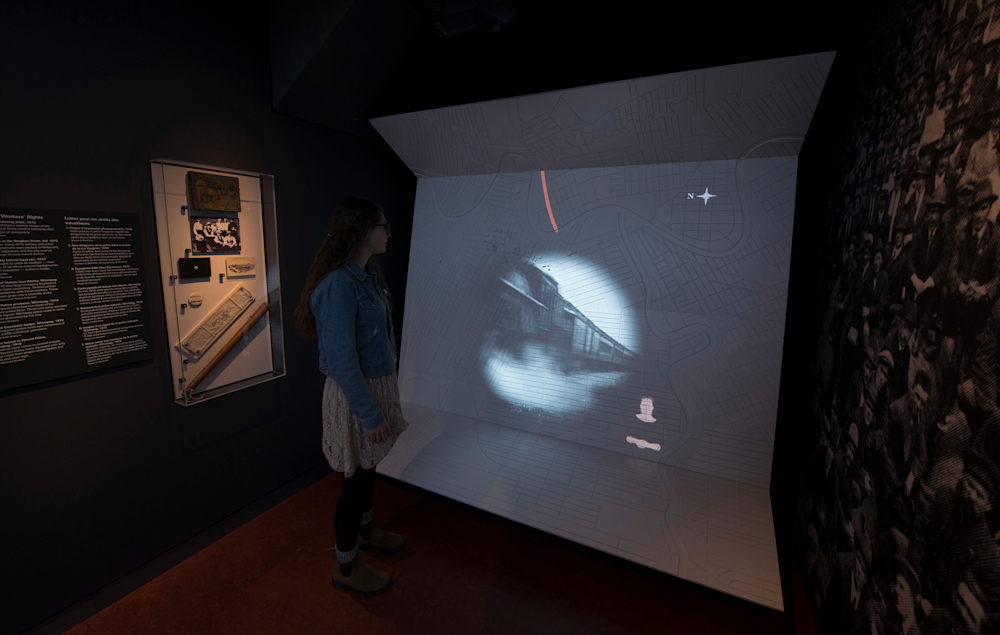 Film projection and animation over dimensionalized, physical map of Winnipeg.