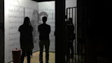 Vistors view images and handwritten letters in a motion-graphics-rich film about Mandela and his family during his years of incarceration.
