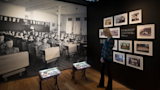 Visitor viewing the Residential Schools exhibit.