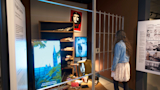 Visitor engaging with the fragile liberties exhibit