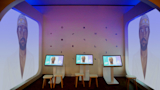 Environmental graphics, interface designs, and artful crops of works of art connect all elements of the space.