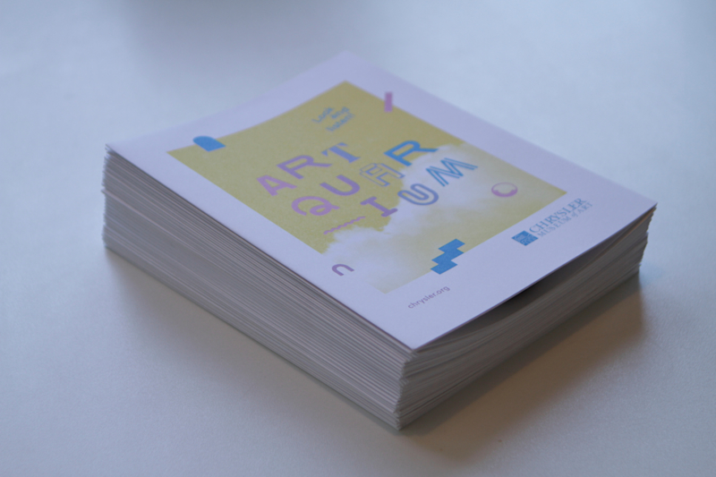 A stack of Artquarium guides with artwork information.
