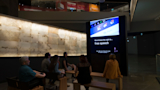 Visitors viewing media literacy film