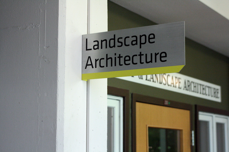 Flag style sign for Landscape Architecture mounted on the wall at the University of Oregon College of Design
